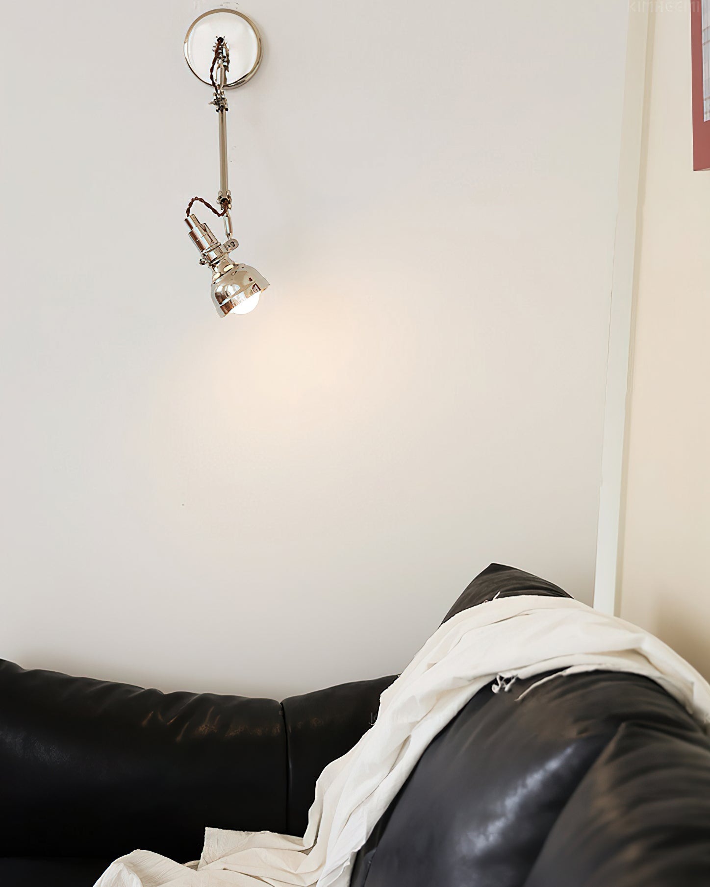 Model B of the Avonni Swing Arm Wall Lamp shown from the side.
