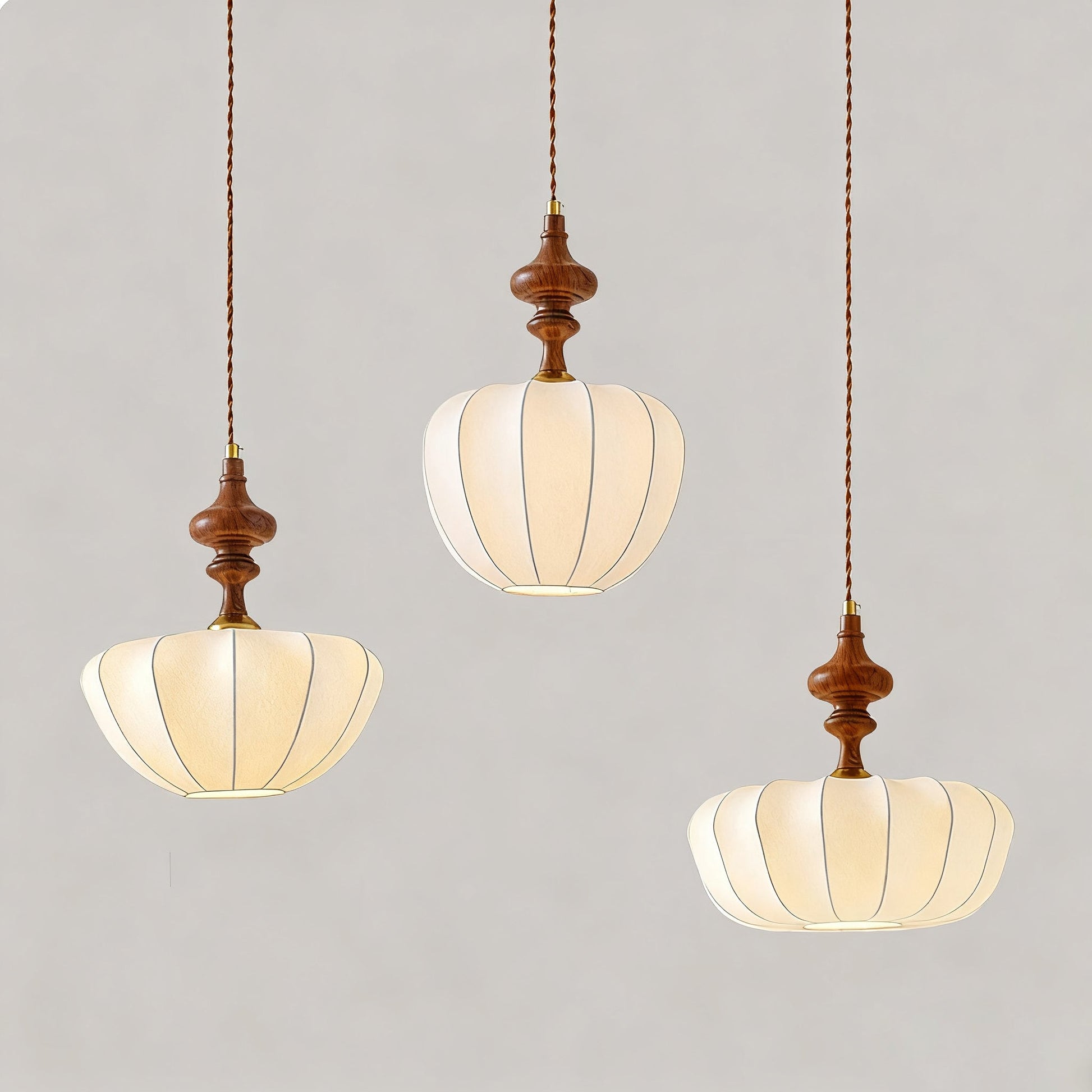 A close-up view of the Baird Pendant Light's pumpkin-shaped shade.