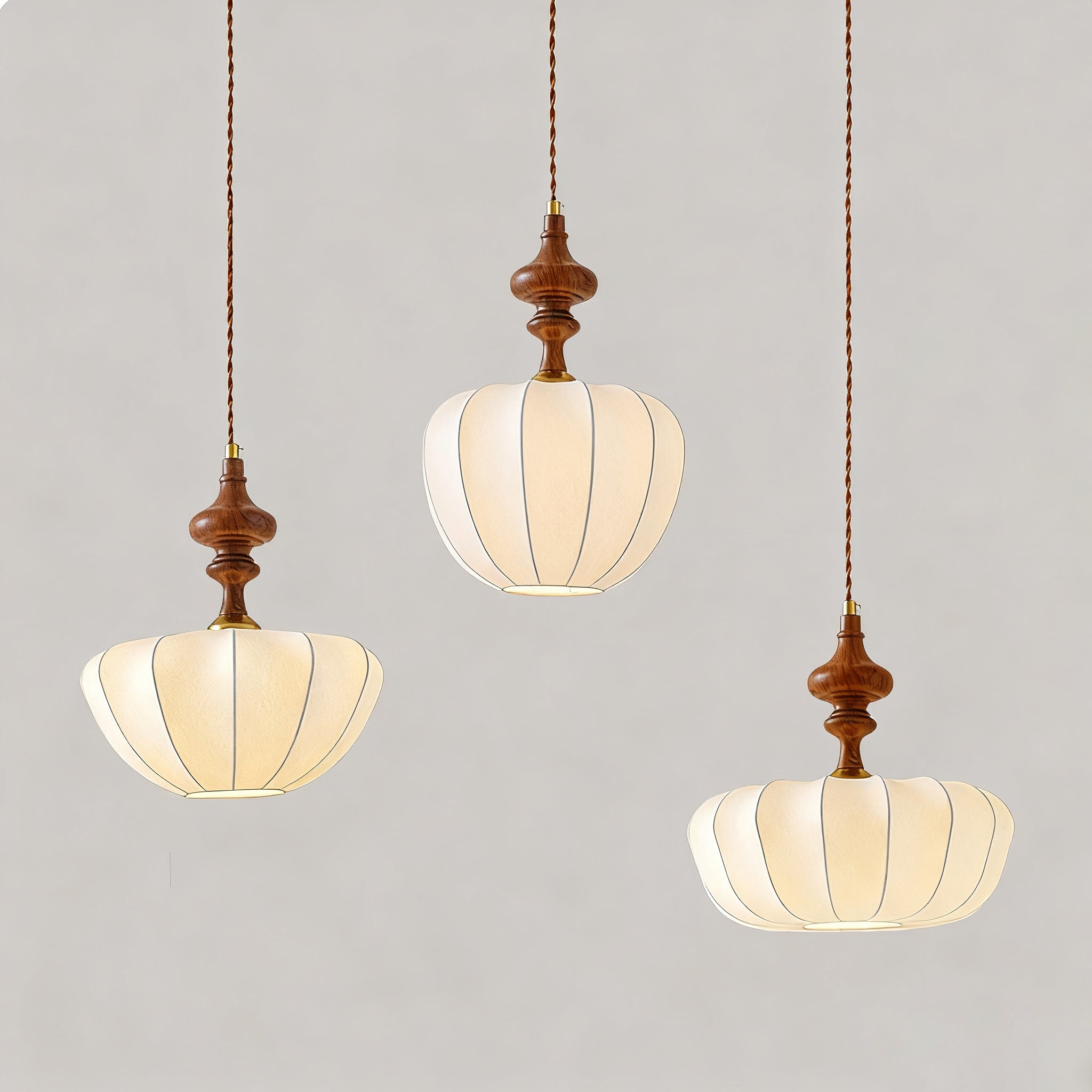 A close-up view of the Baird Pendant Light's pumpkin-shaped shade.