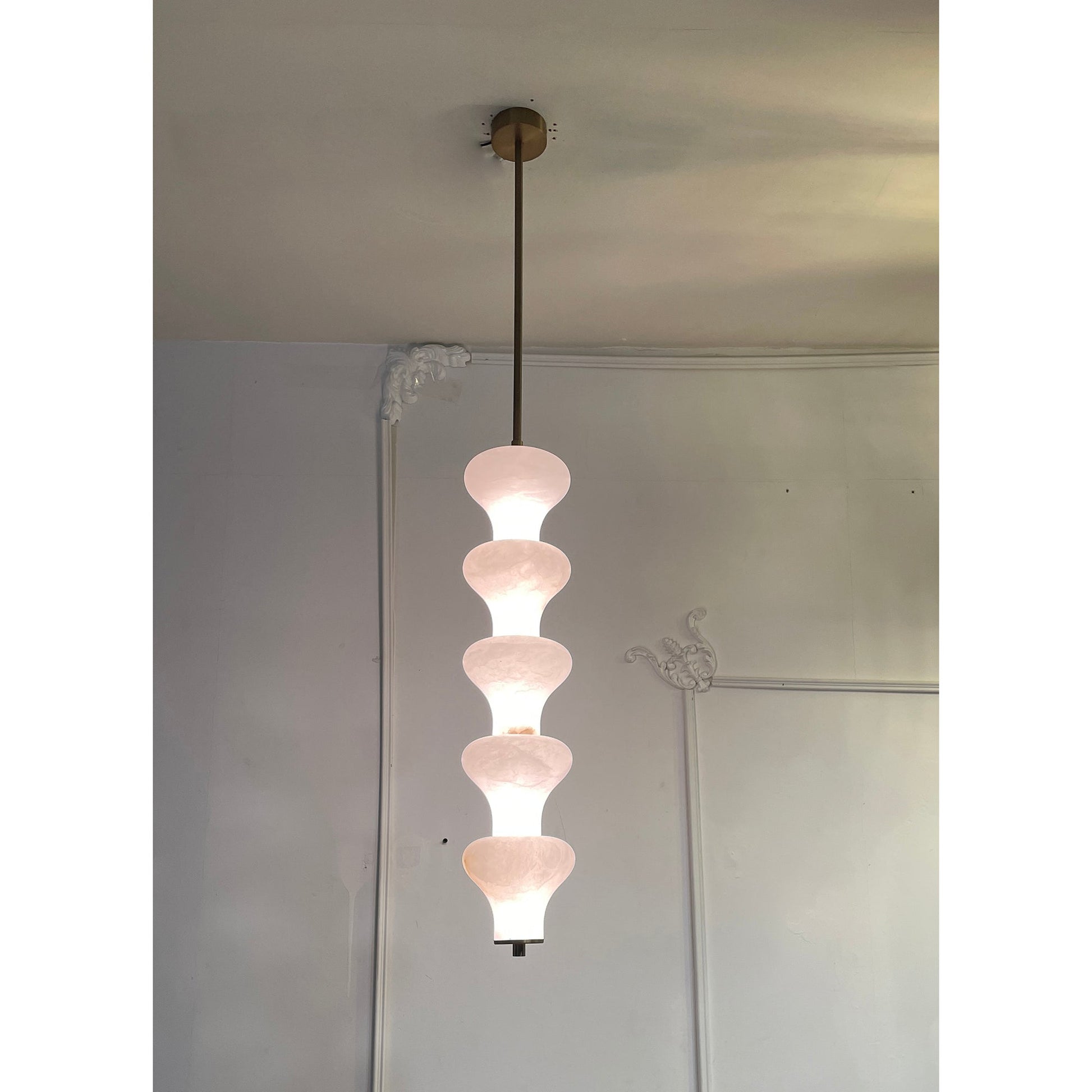 The pendant lamp shown in a contemporary hallway.
