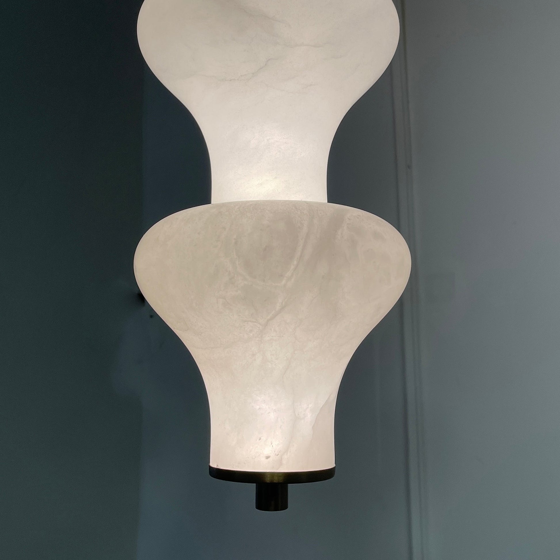 Unlit view of the pendant lamp showcasing its material and form.