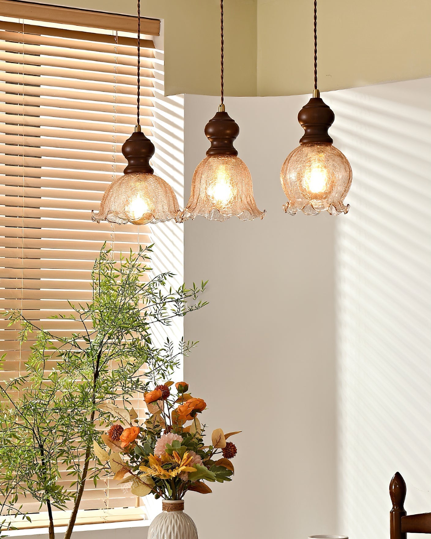 Multiple Barron Pendant Lights hanging at different heights in a dining room.