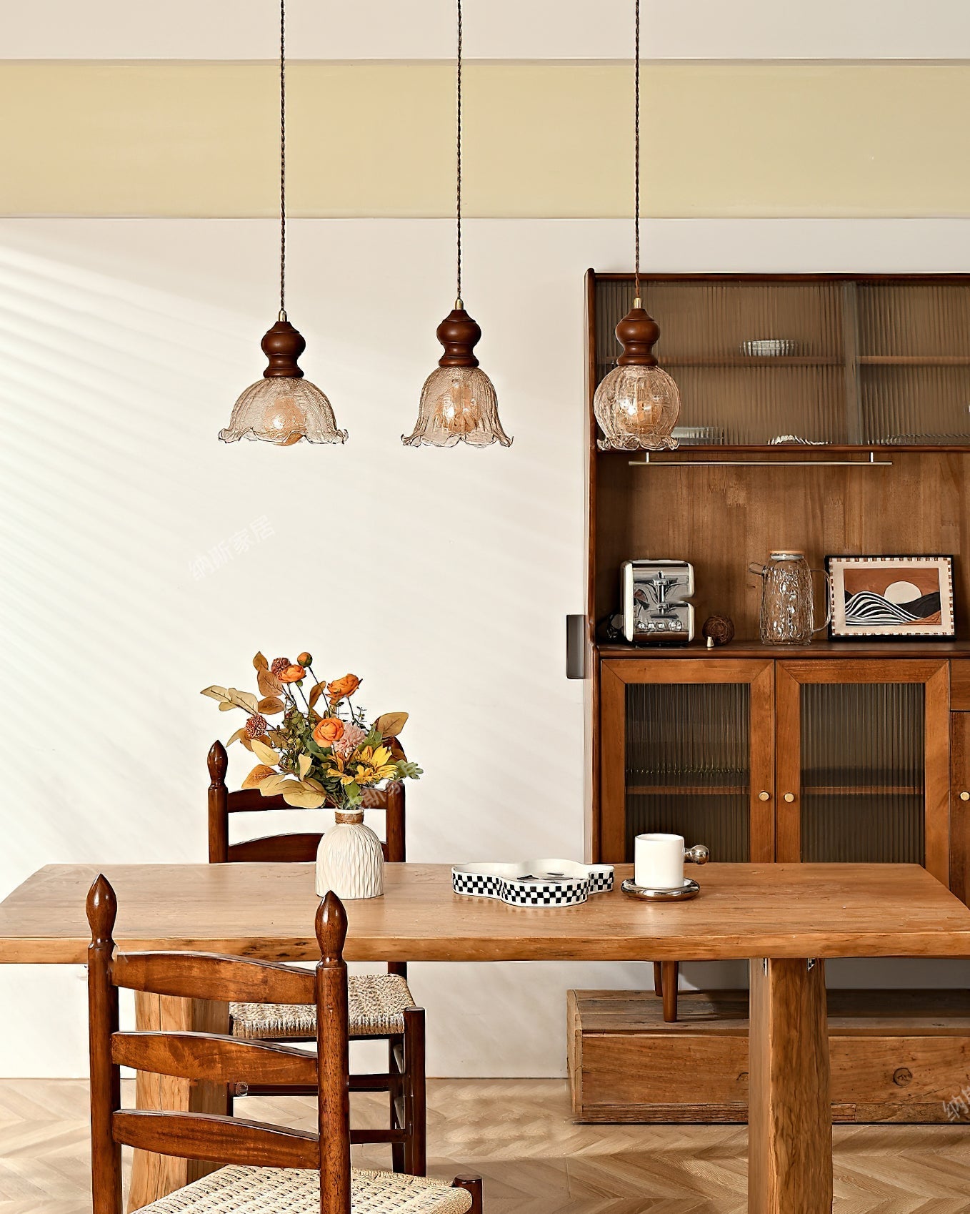 Three Barron pendant lights hanging from a long rectangular ceiling canopy.