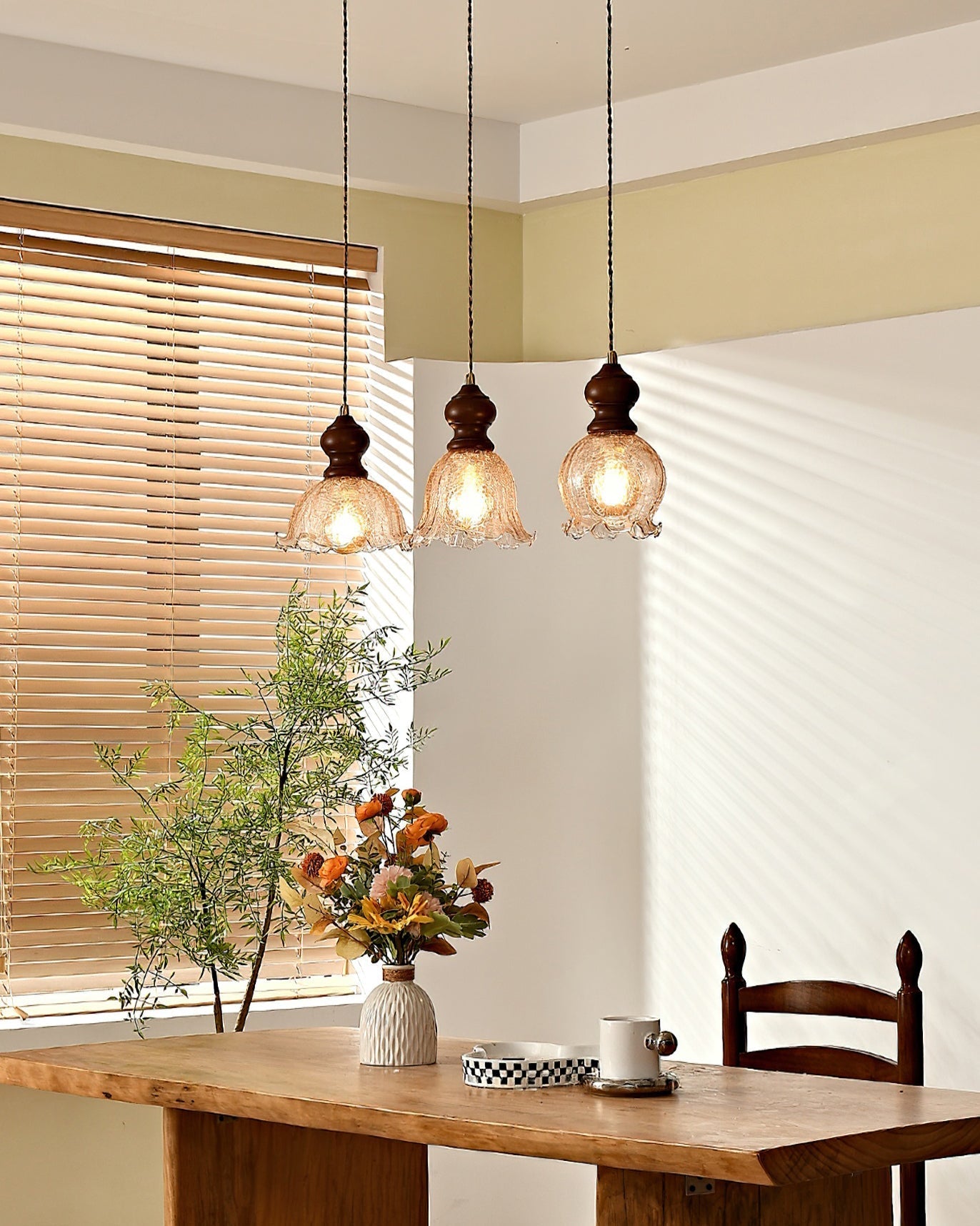 Three Barron pendant lights hanging from a round ceiling canopy.