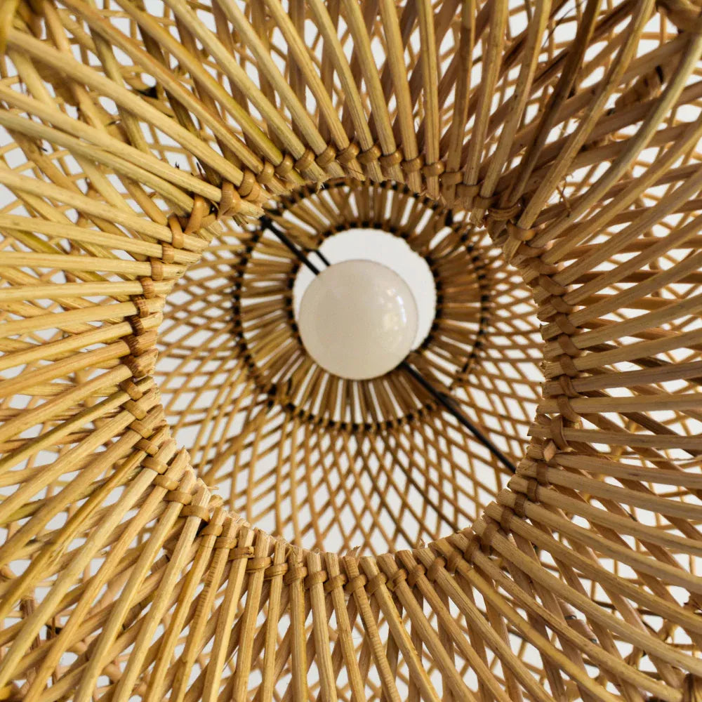 The warm, ambient light filtered through the Bawang rattan shade at night.