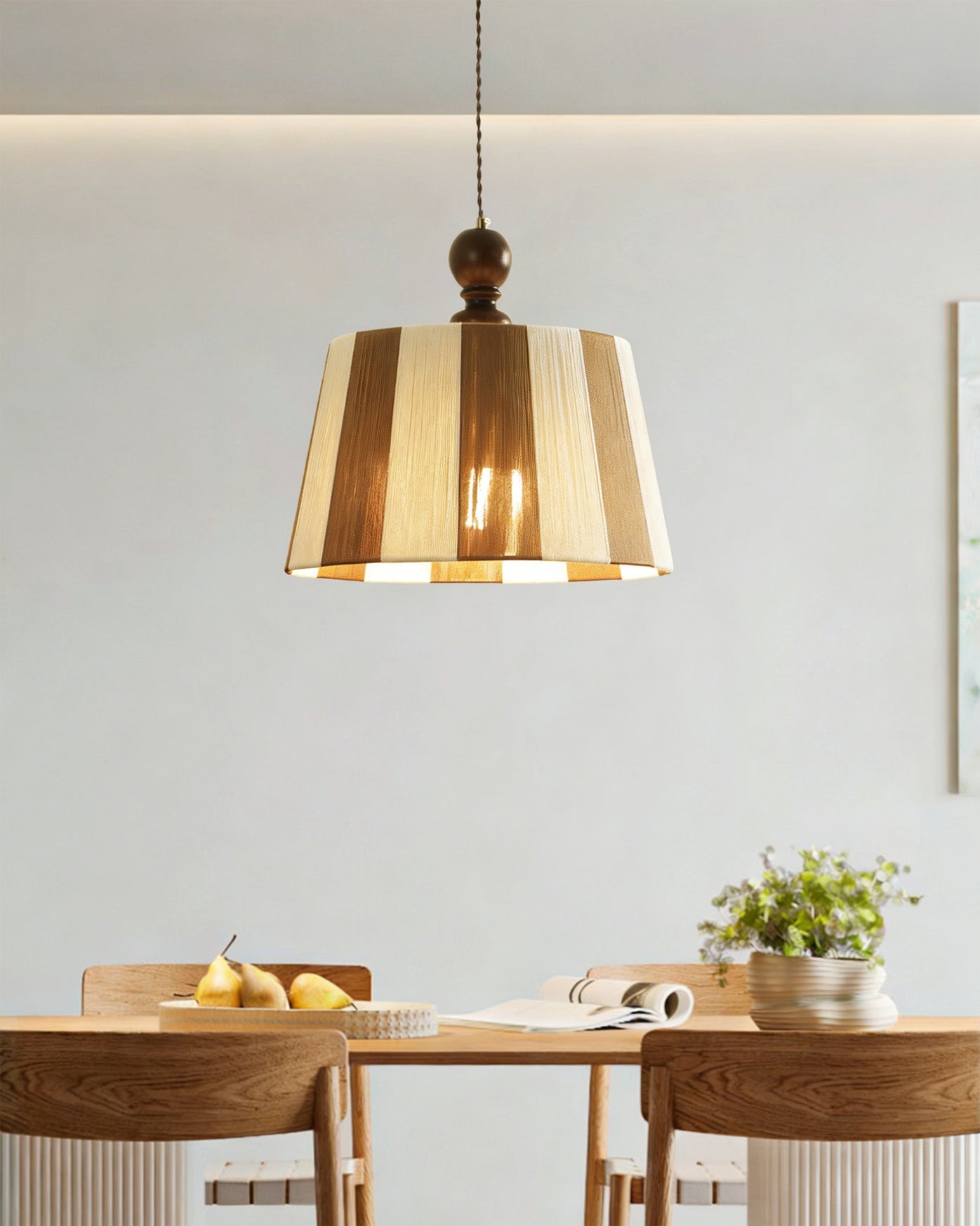 The Beatrice Pendant Light hanging in a modern living room setting.