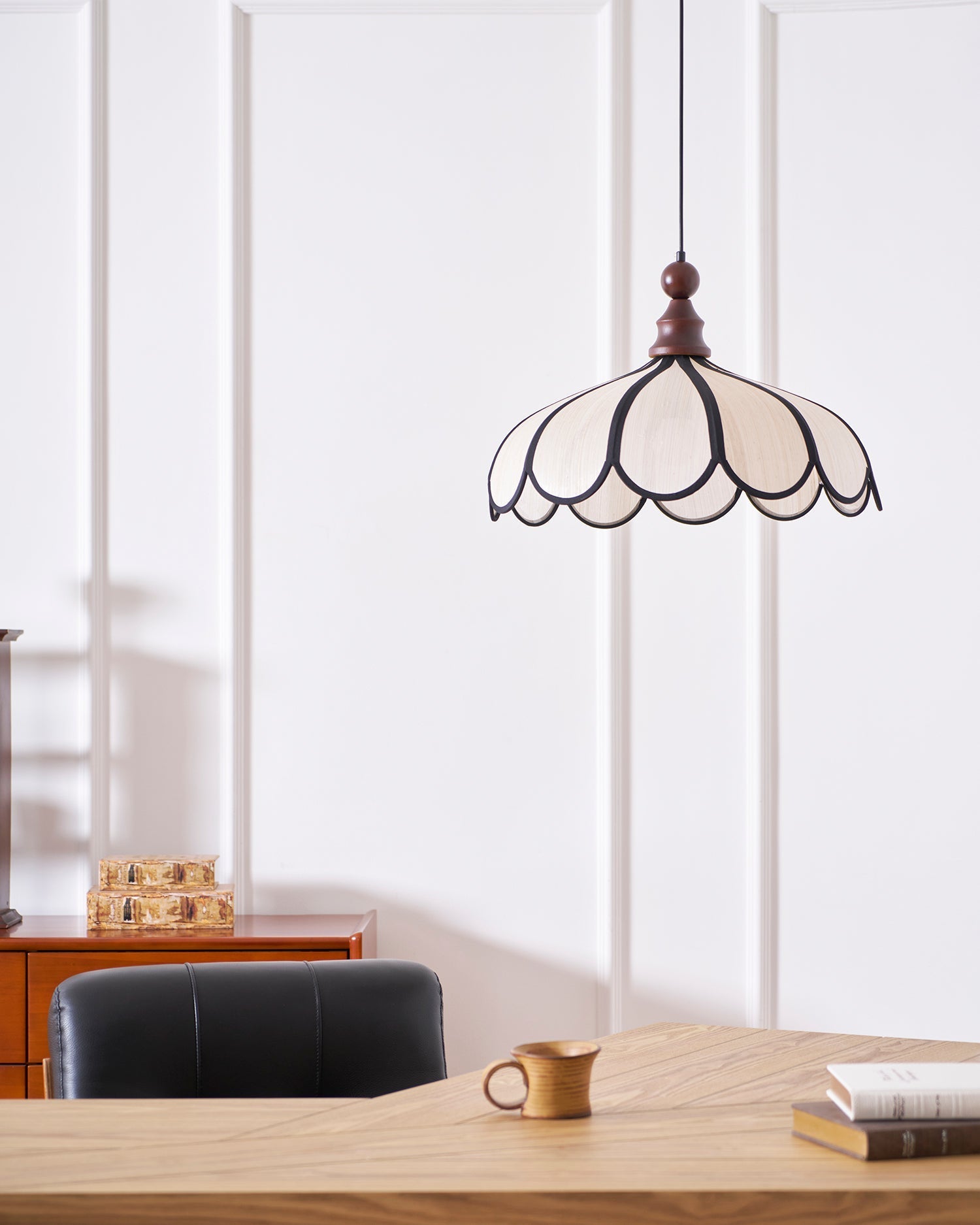 The large 60cm Botan Pendant Light as a statement piece in a high-ceiling room.