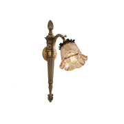 Benson Wall Lamp with antiqued brass arm and fluted amber glass shade.