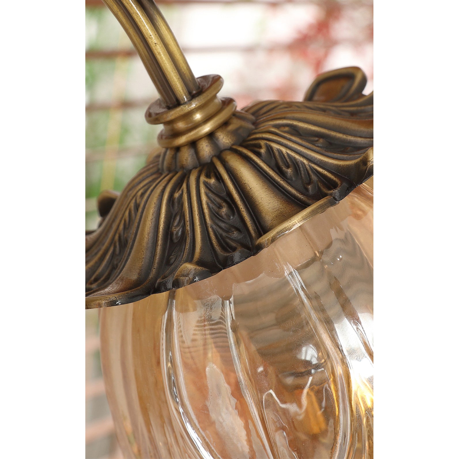 Benson Wall Lamp in a library setting, complementing dark wood decor.