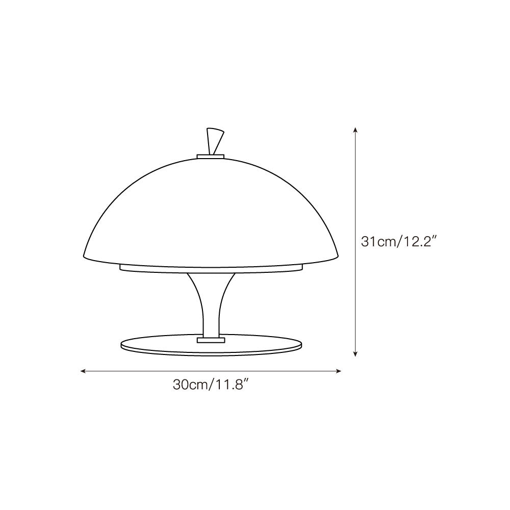 The Beret Table Lamp illuminating a modern living room setting.