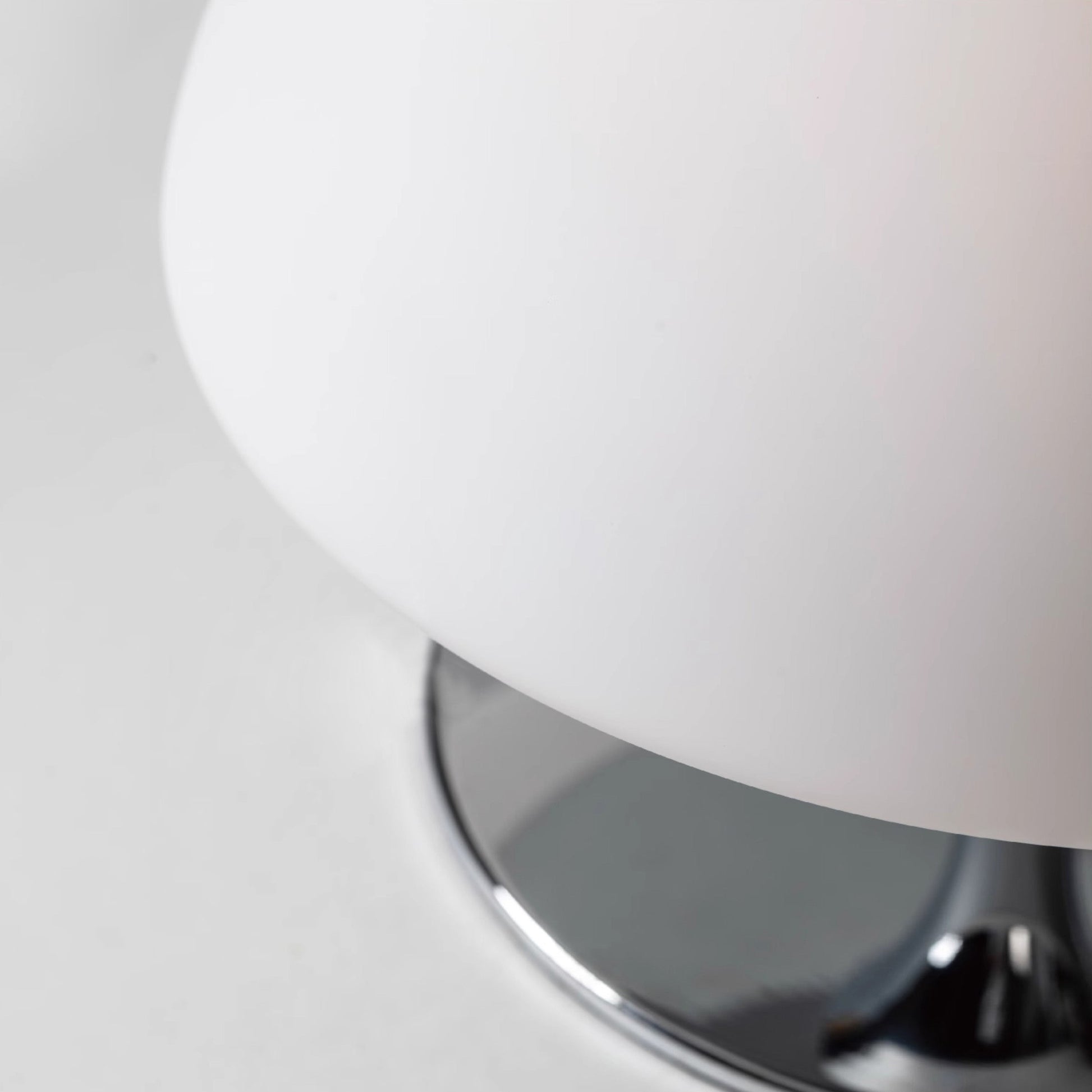 Full product view of the Beret Table Lamp with its charging cable.