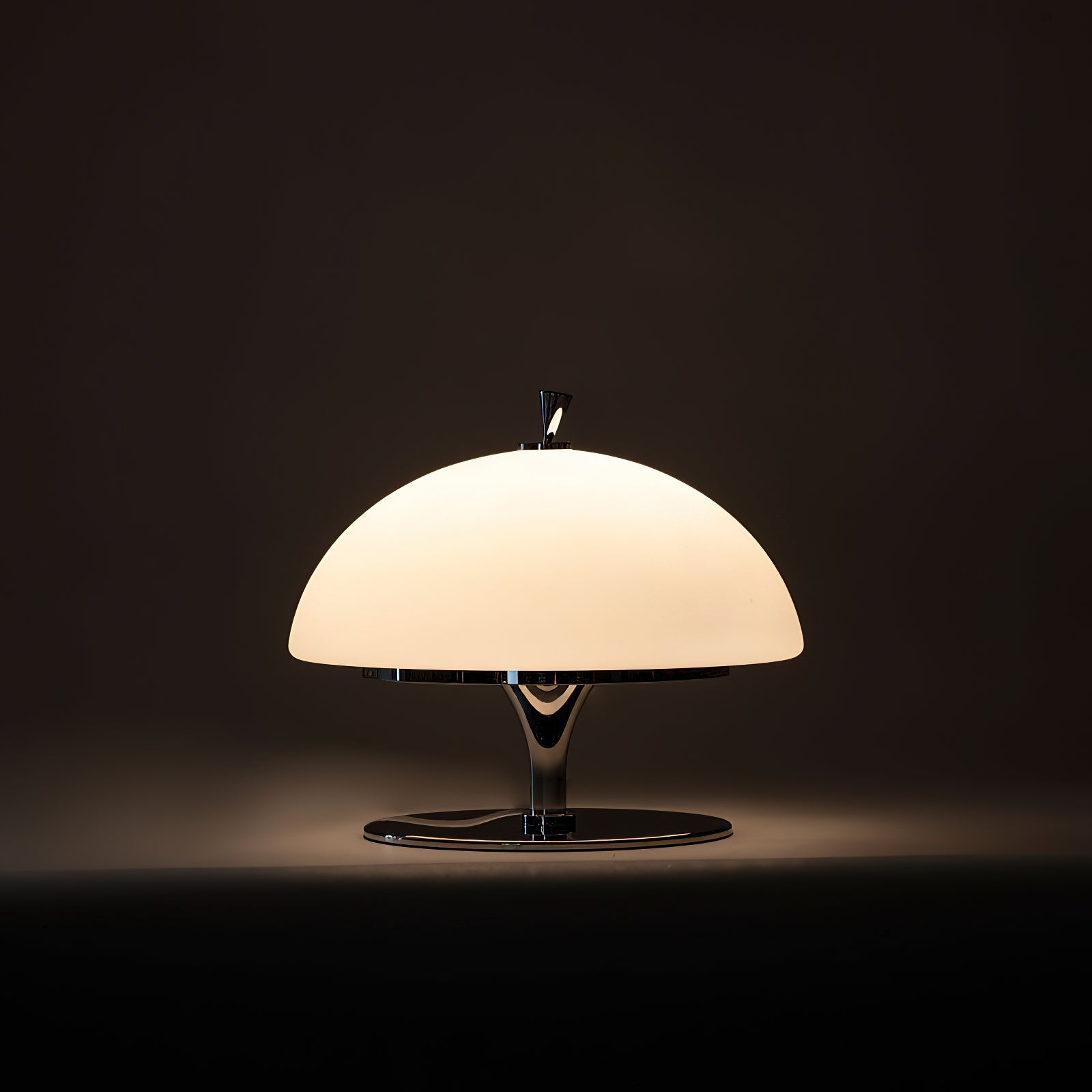 Beret Table Lamp placed on a nightstand in a contemporary bedroom.