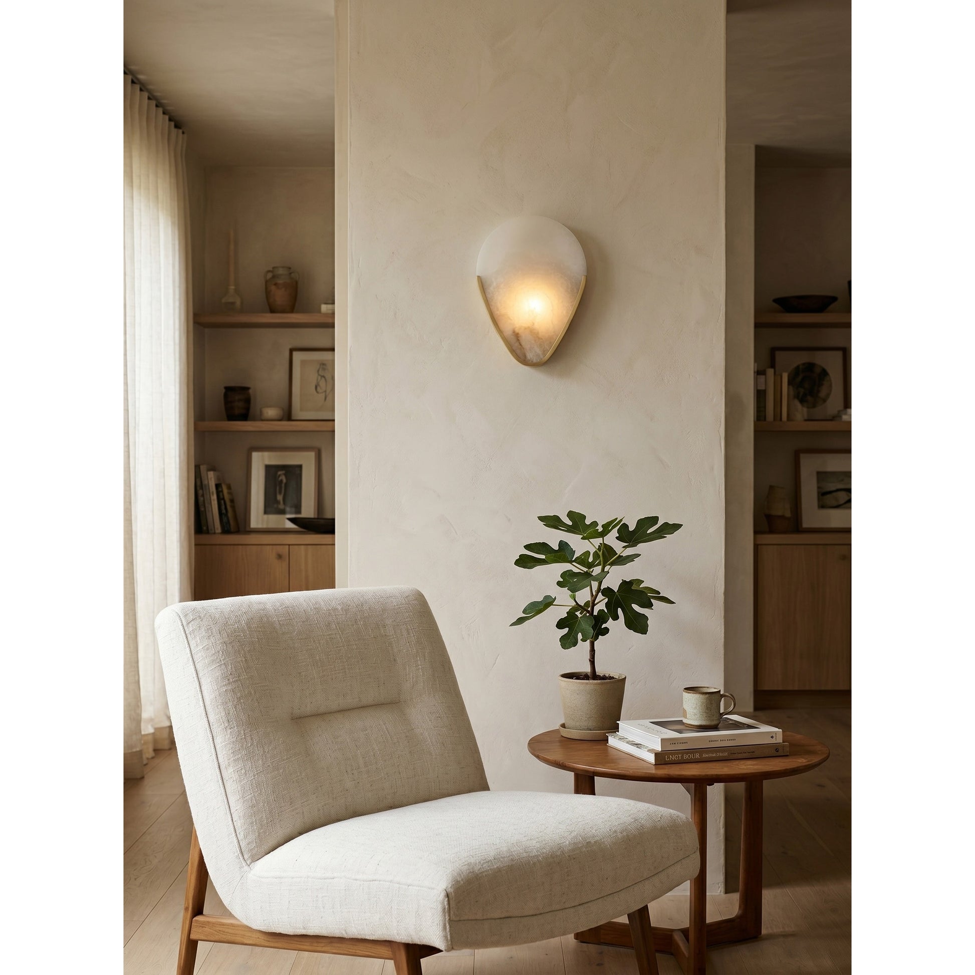 Bernina Wall Lamp illuminated in a dark room, casting a warm glow.