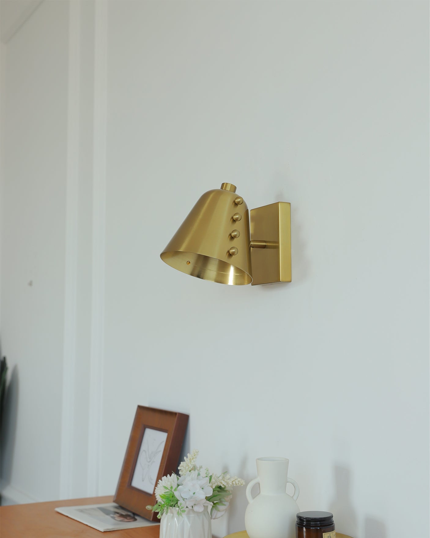 Bespoke wall lamp in a hallway, creating an inviting atmosphere.