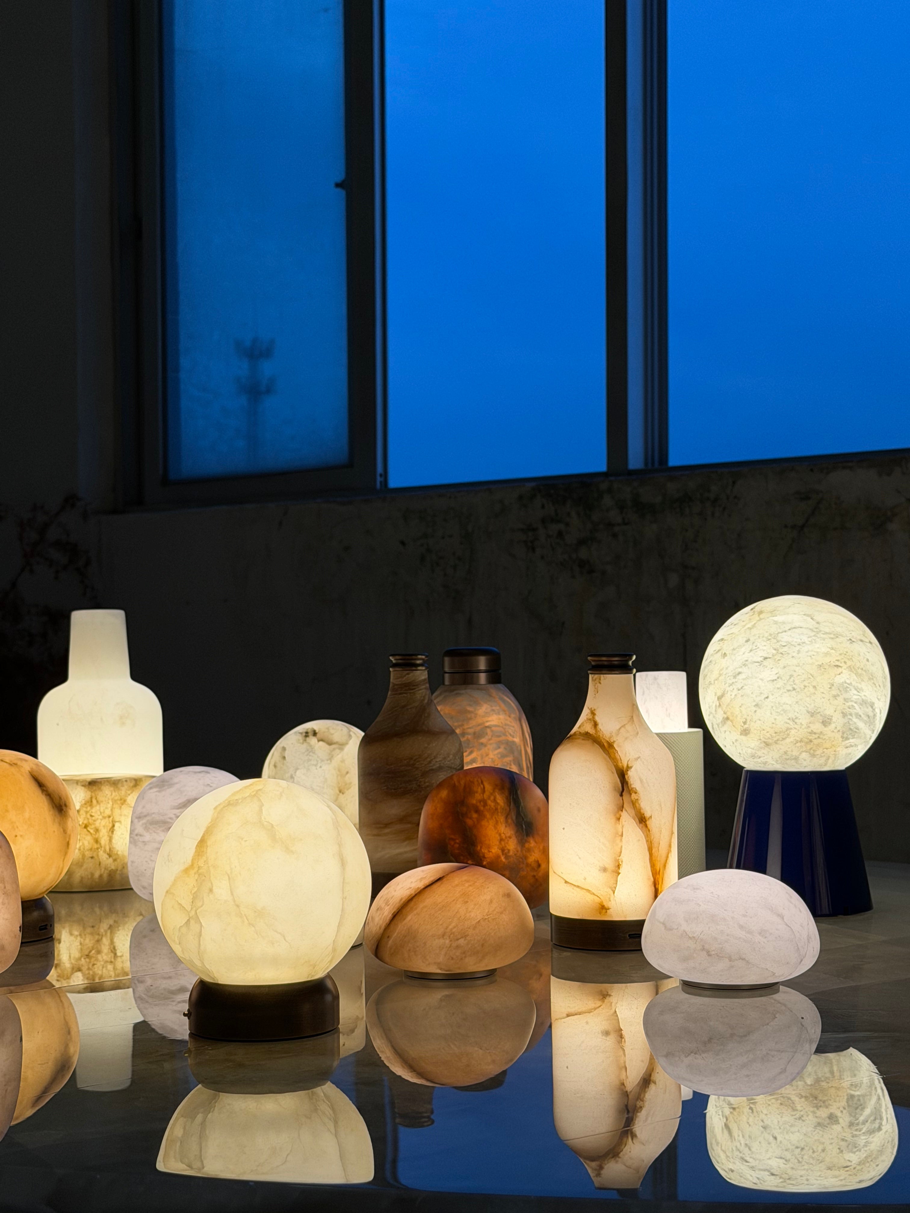 A size comparison of the small and large Bilia Mini Table Lamps.