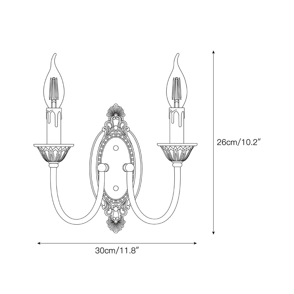 The Blair Candle Wall Sconce illuminated with a warm LED flame bulb.