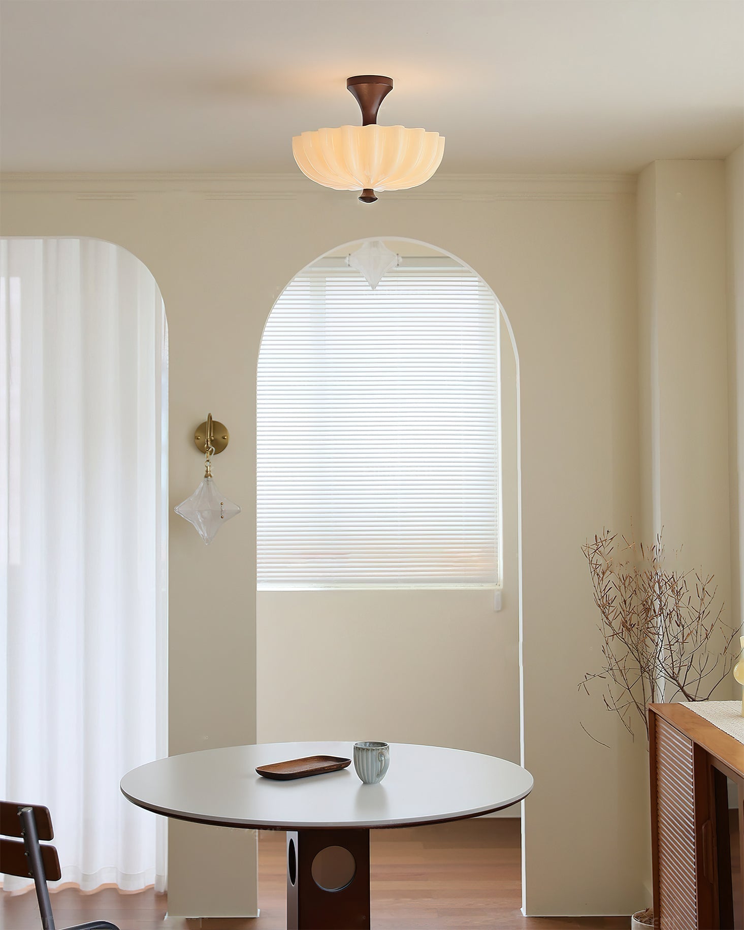 The ceiling lamp shown in a cozy bedroom setting, providing warm light.