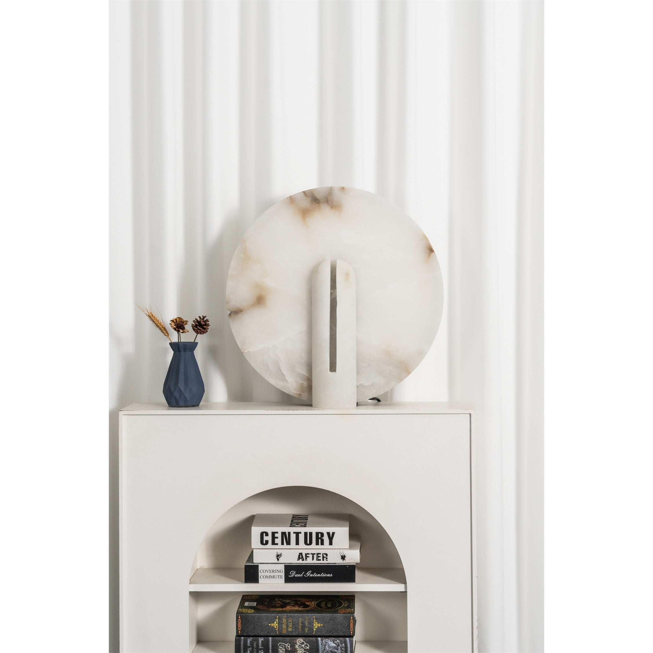 The lamp on a nightstand in a modern bedroom.