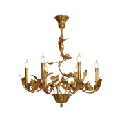 Borgia Brass Chandelier with leaf motif in a dining room setting.