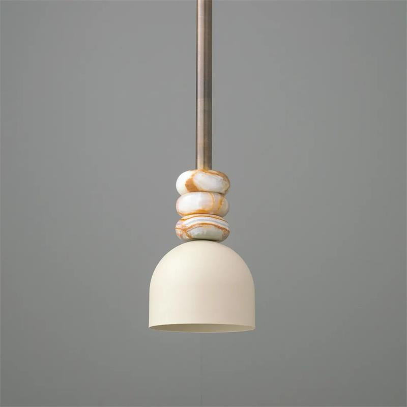 Close-up of the Boston Pendant Lamp highlighting the texture of the marble and brass.