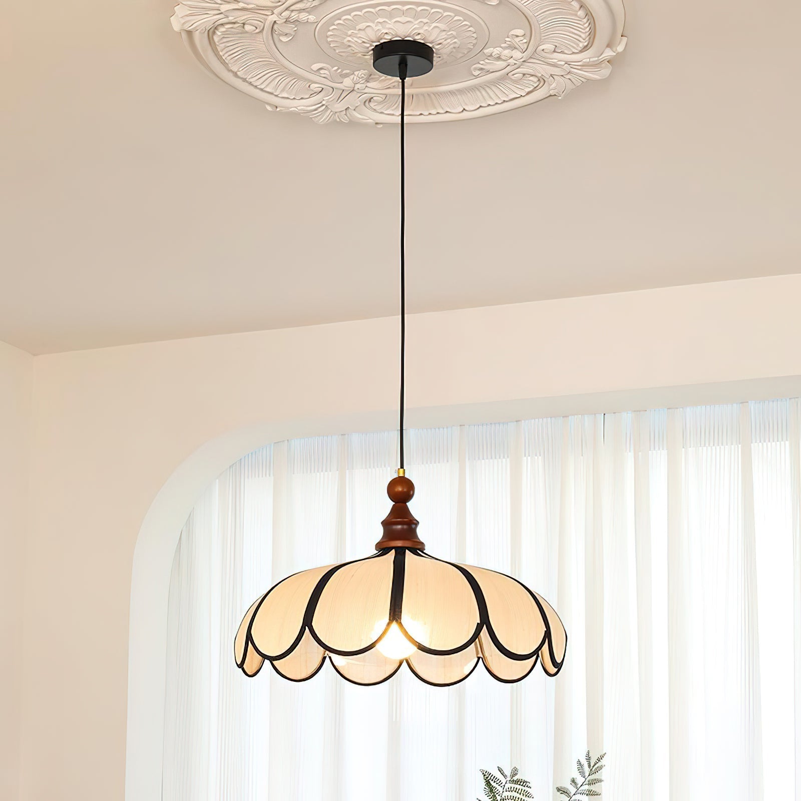 The ceiling canopy and suspension wire of the Botan Pendant Light.