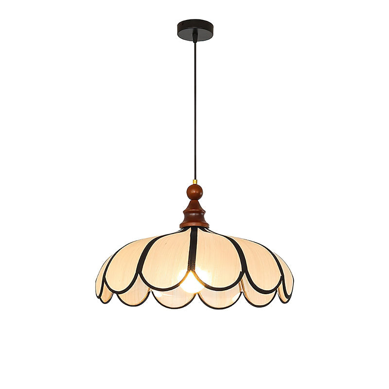 Botan Pendant Light illuminated at night, casting a warm glow.
