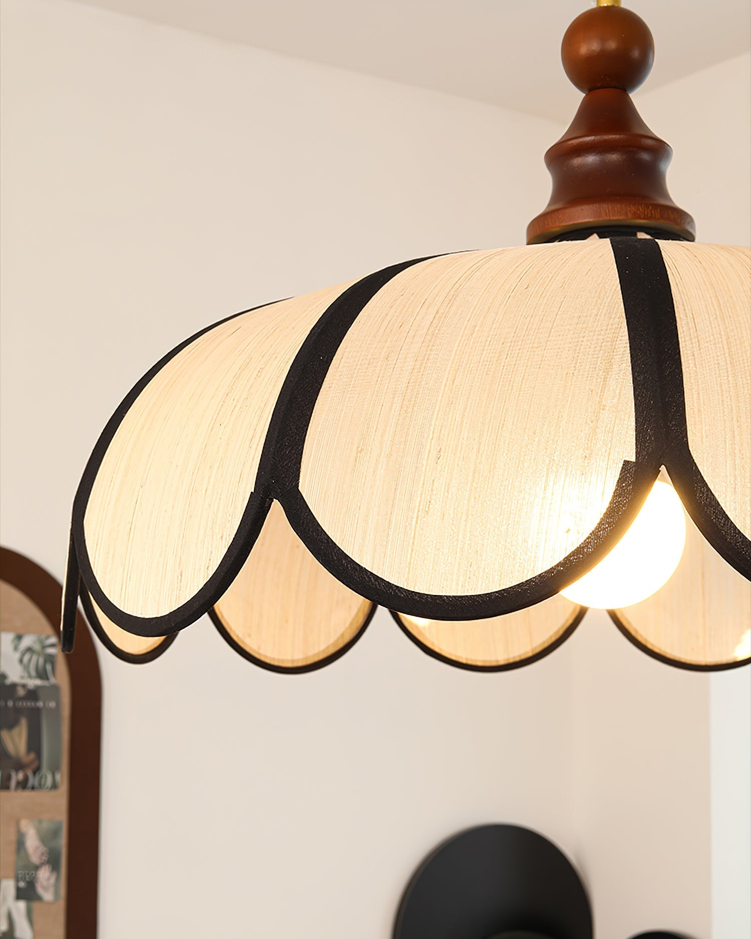 Close-up on the bold black trim that edges the abaca shade.