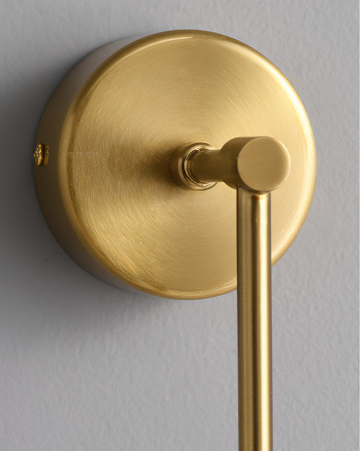 The Brace Alabaster Wall Lamp with the gold finish option.