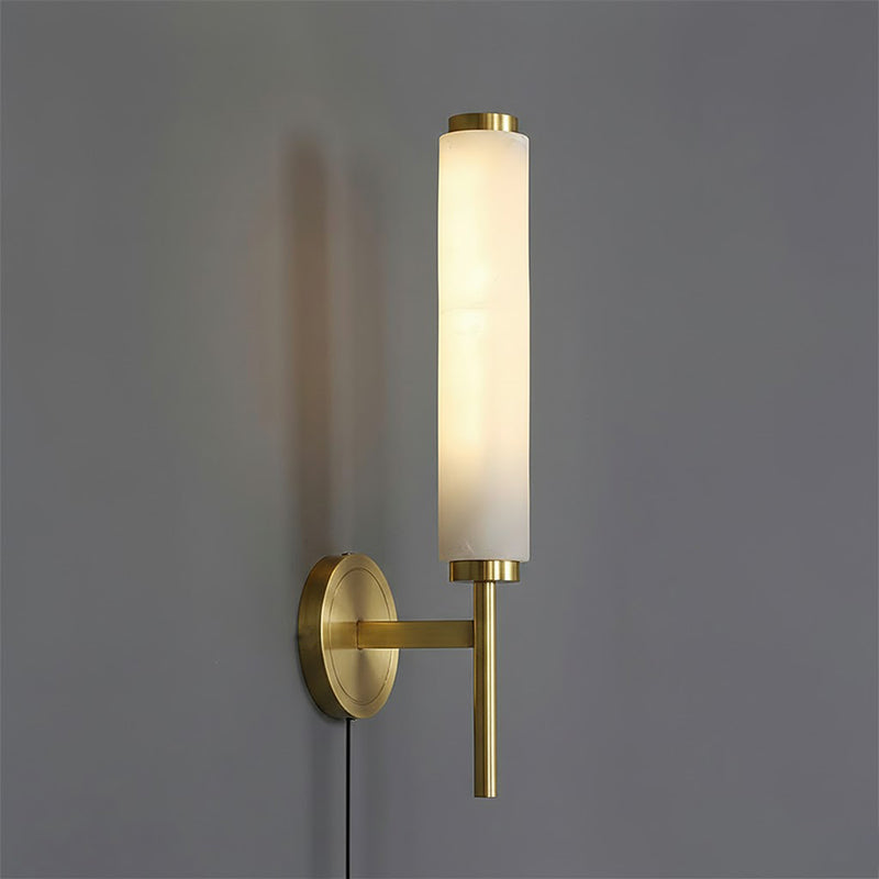 The wall lamp installed in a bedroom above a nightstand.