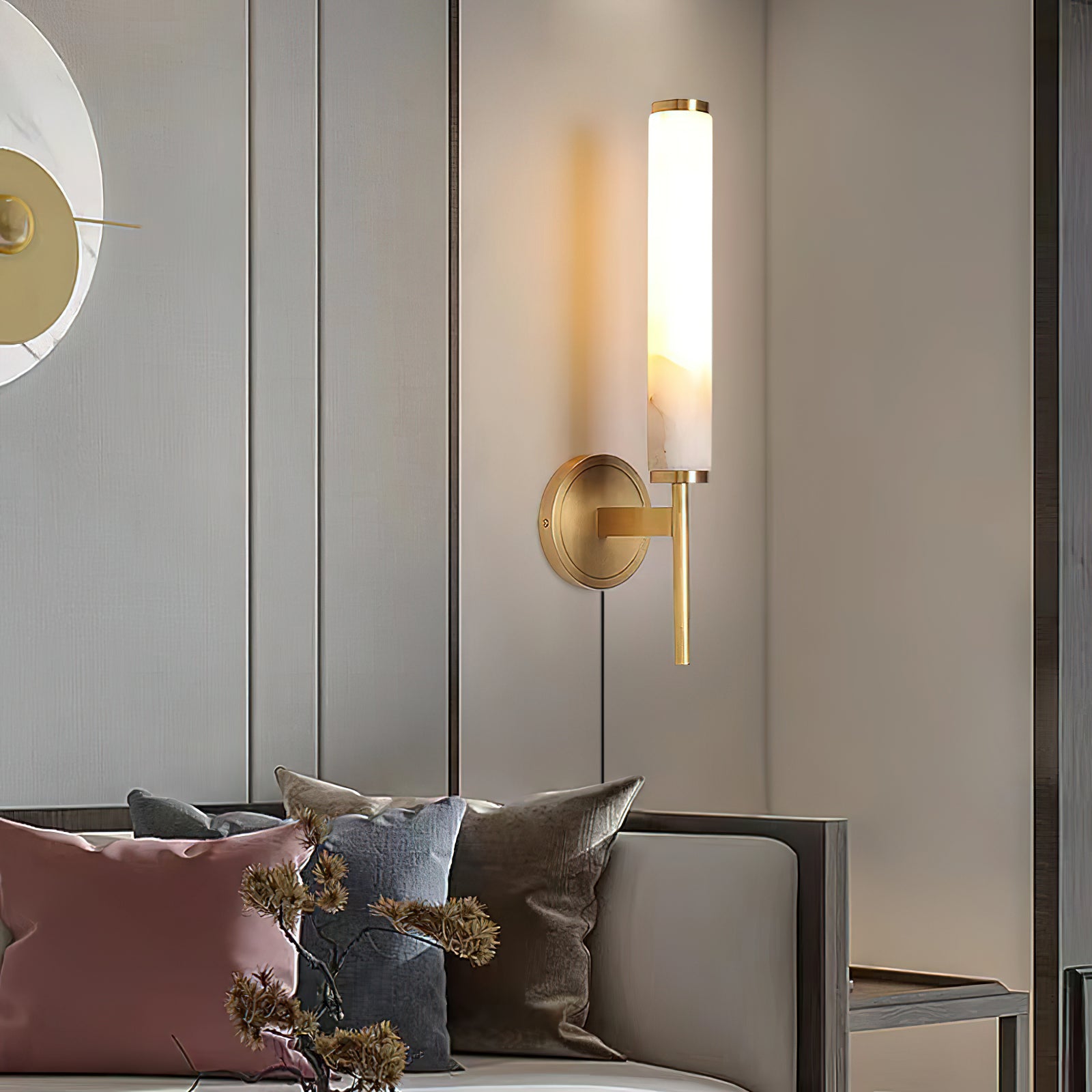Side view of the Brindisi Wall Lamp, highlighting its slender arm and brass body.