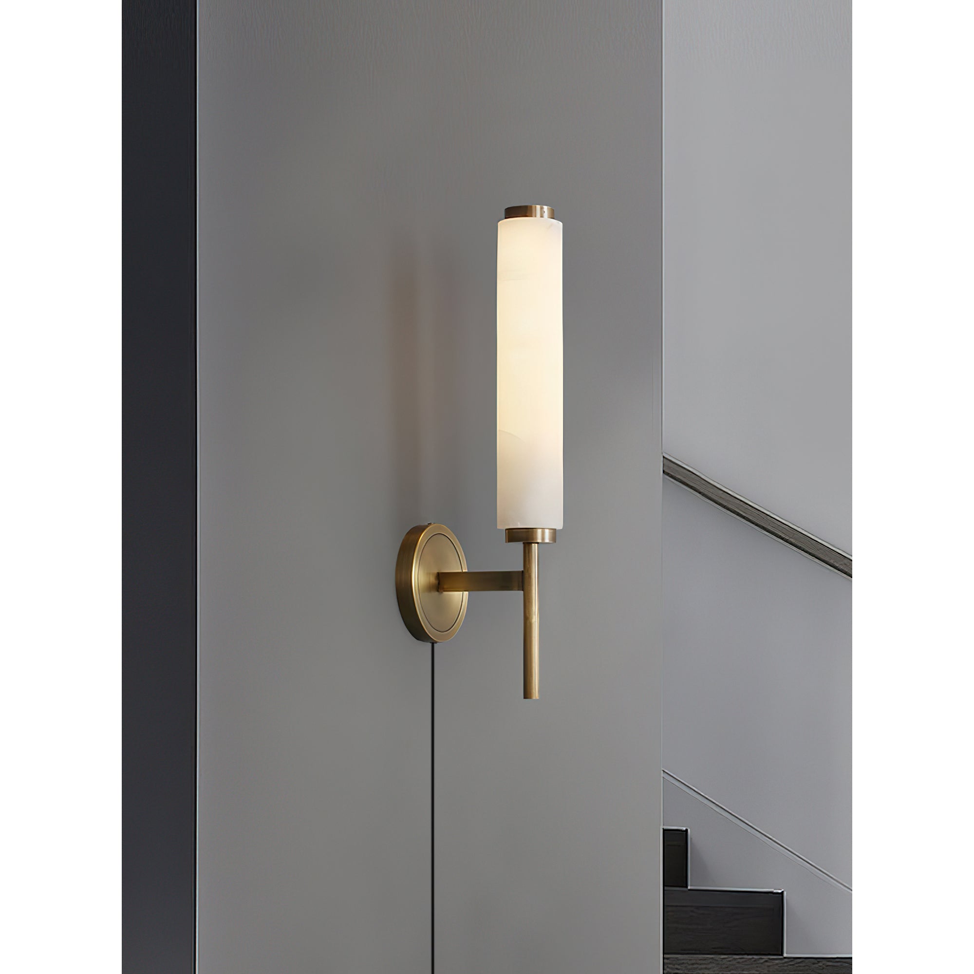 Detail shot of the brass finish on the lamp's tubular support.