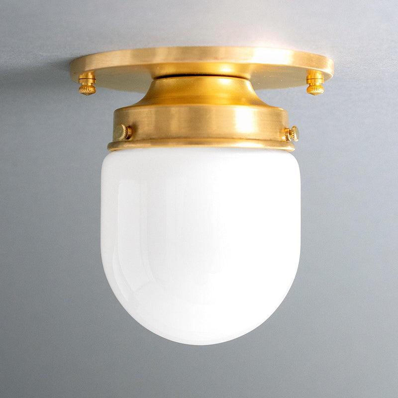 Lifestyle image of the ceiling lamp illuminating a stylish kitchen island.