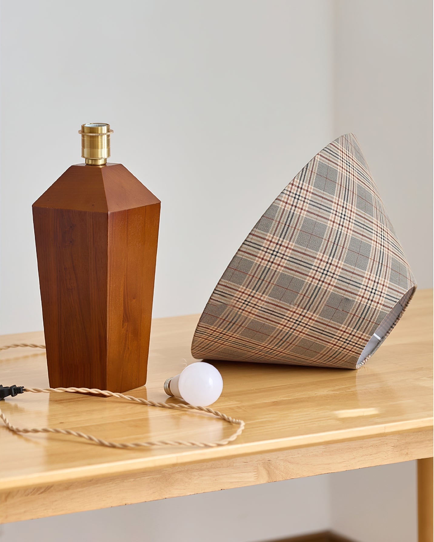 Detail shot of the solid wood base with a walnut finish.