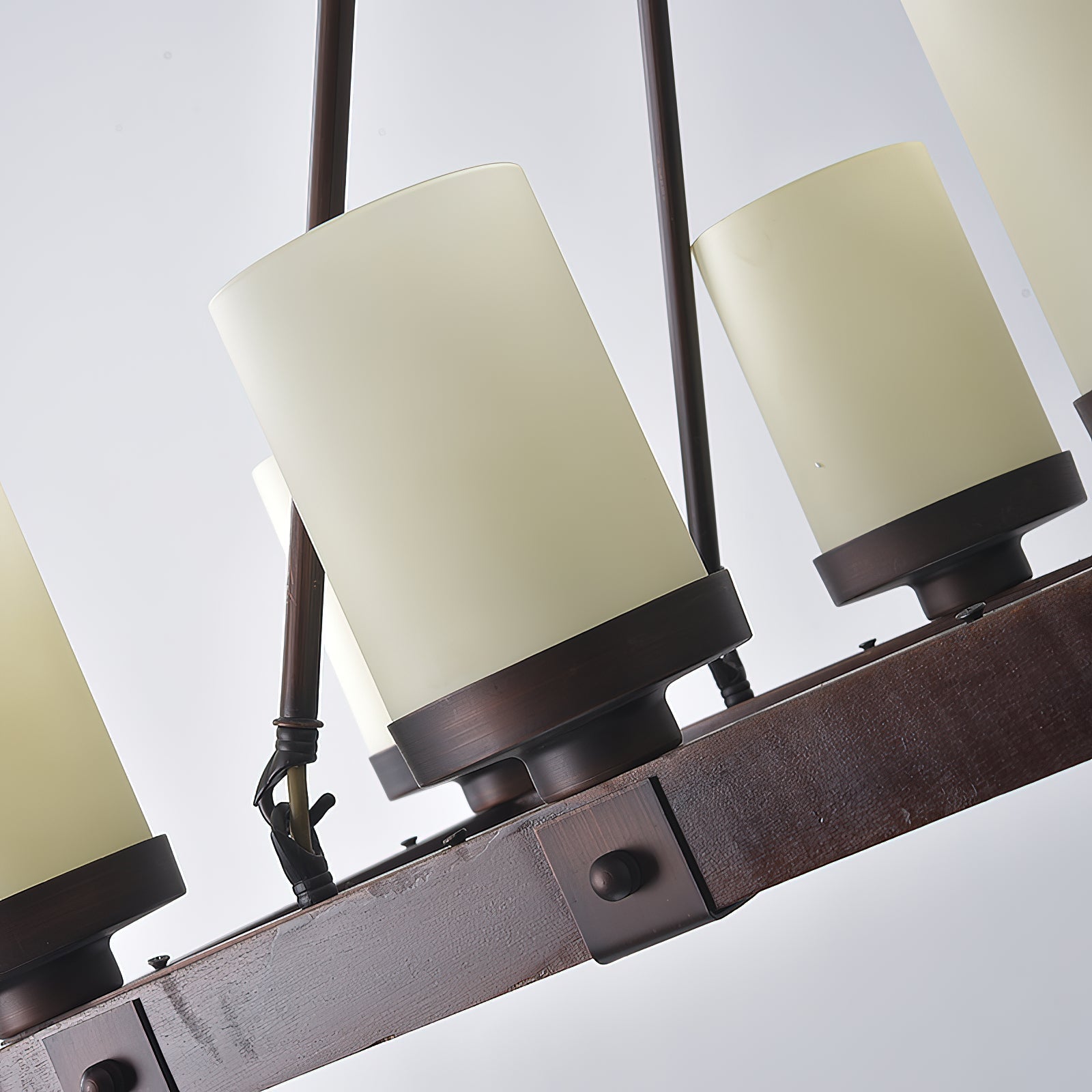 Detail of the chain connecting to the ceiling canopy.