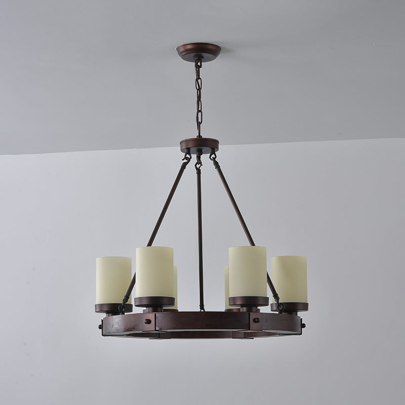 The rich walnut finish of the Cabot chandelier's wooden frame.