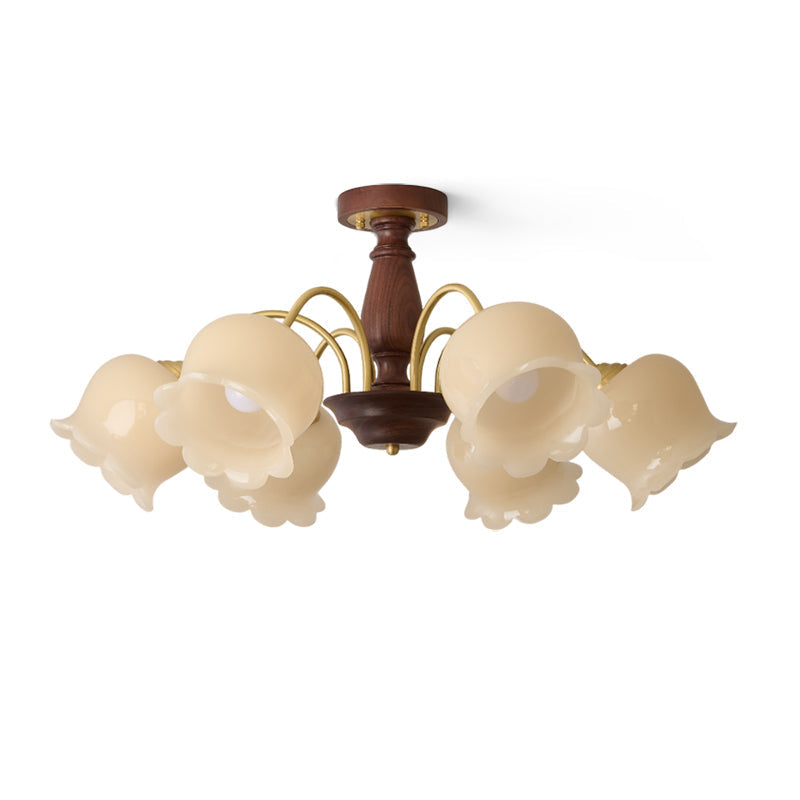 Close-up of the brass finish and walnut wood accent on the chandelier.