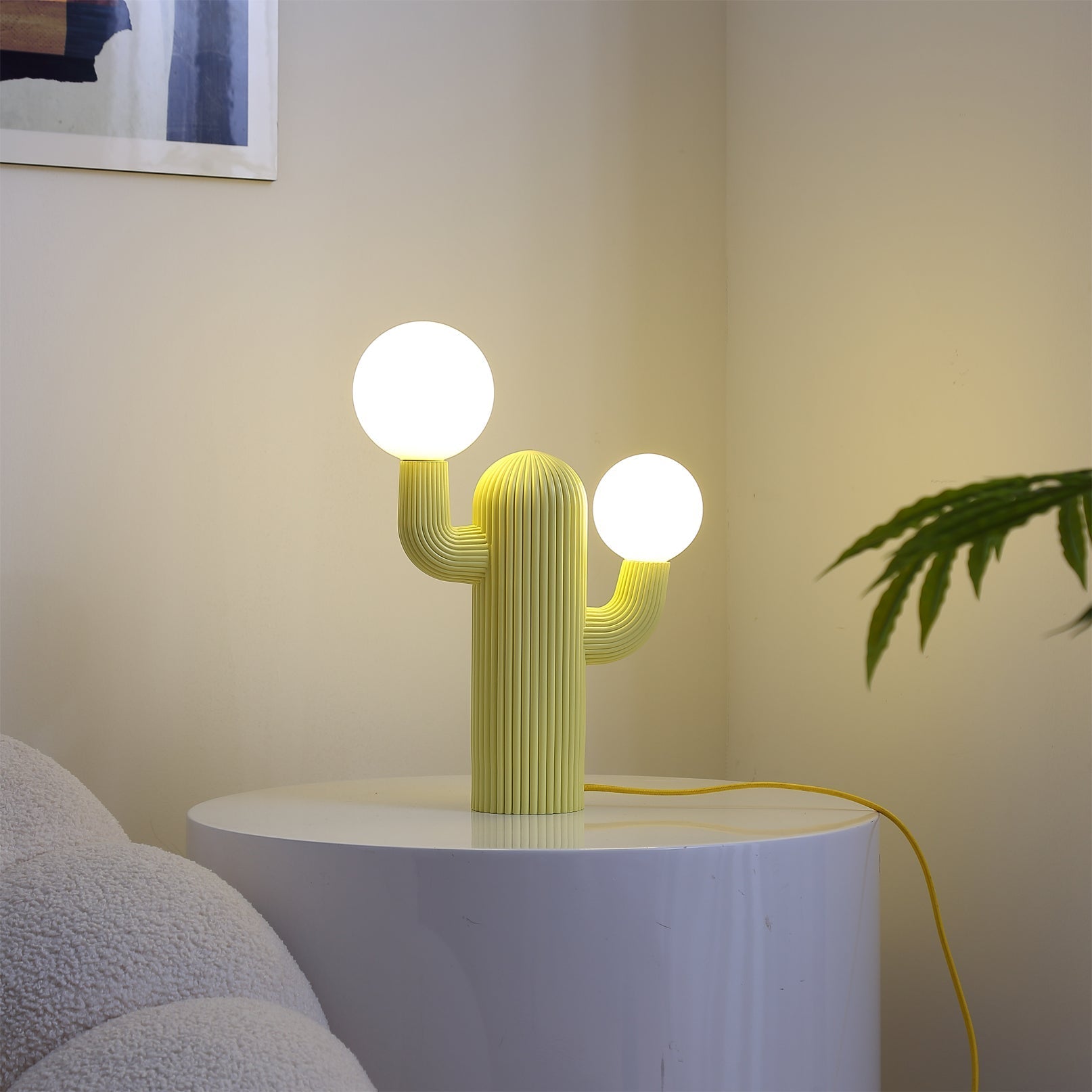 The Cactus Table Lamp in a living room setting on a side table.