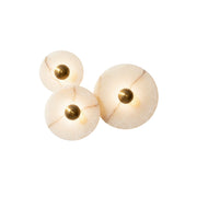 Calacatta marble and alabaster wall sconce in a gold finish.