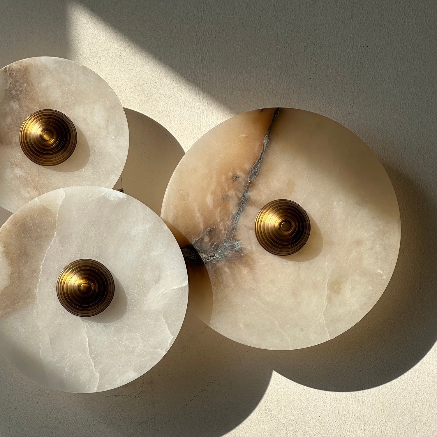The white finish sconce in a bright and airy room setting.