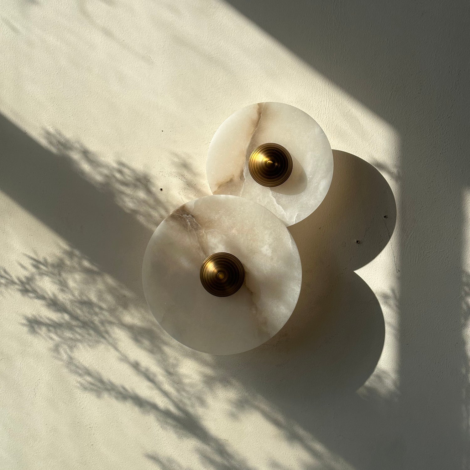 Side-by-side comparison of the 2-head and 3-head sconce sizes.