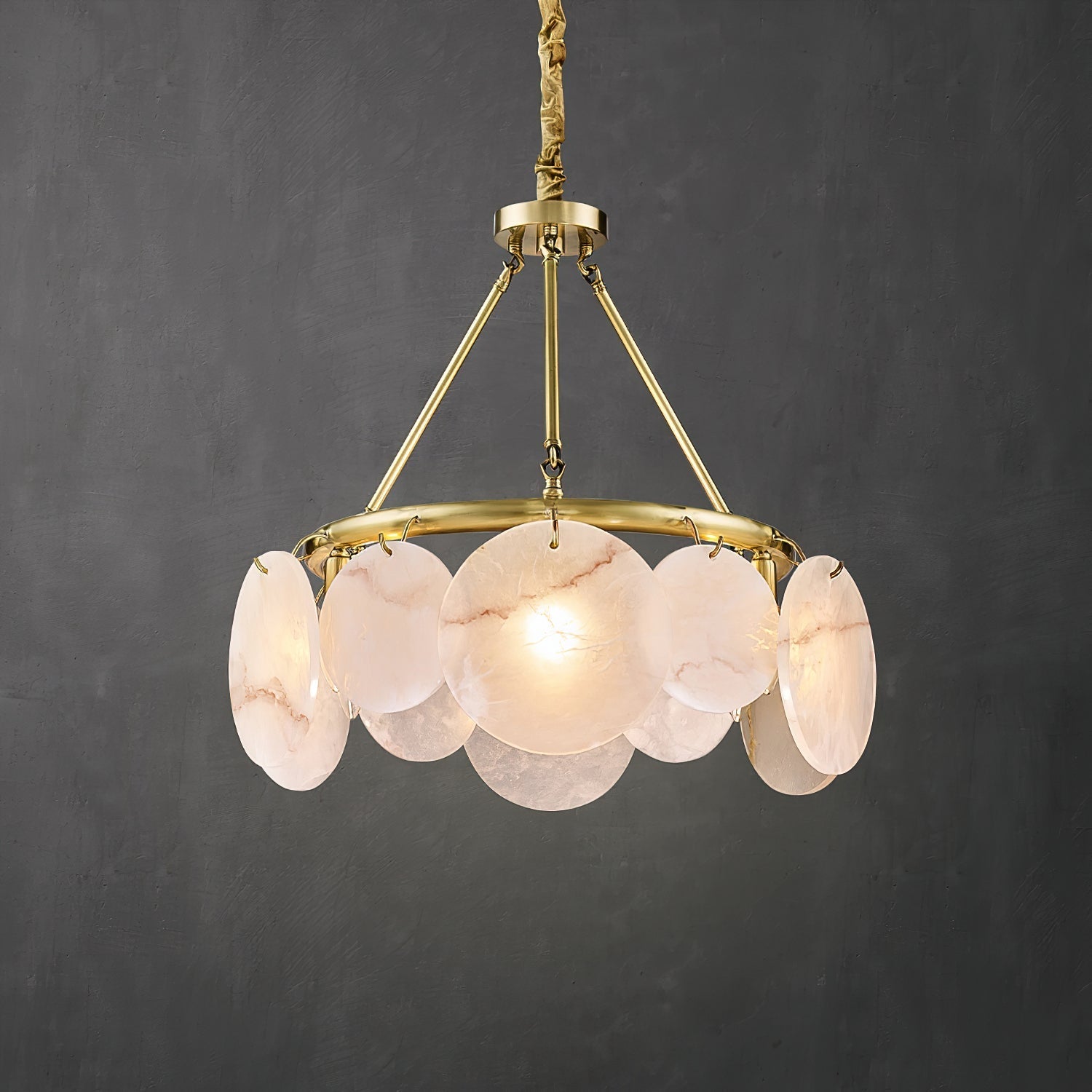 Close-up view of the Calamete Chandelier's natural alabaster shades.