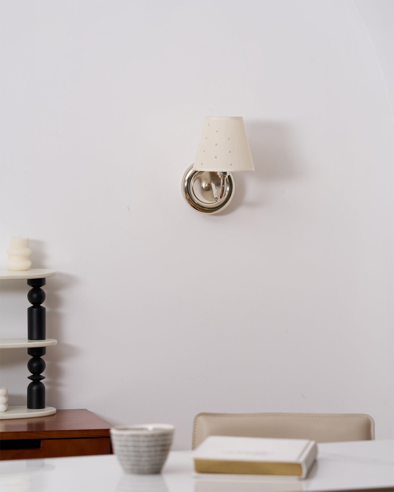 The Caleb sconce turned on, demonstrating the dual-directional wall wash effect.