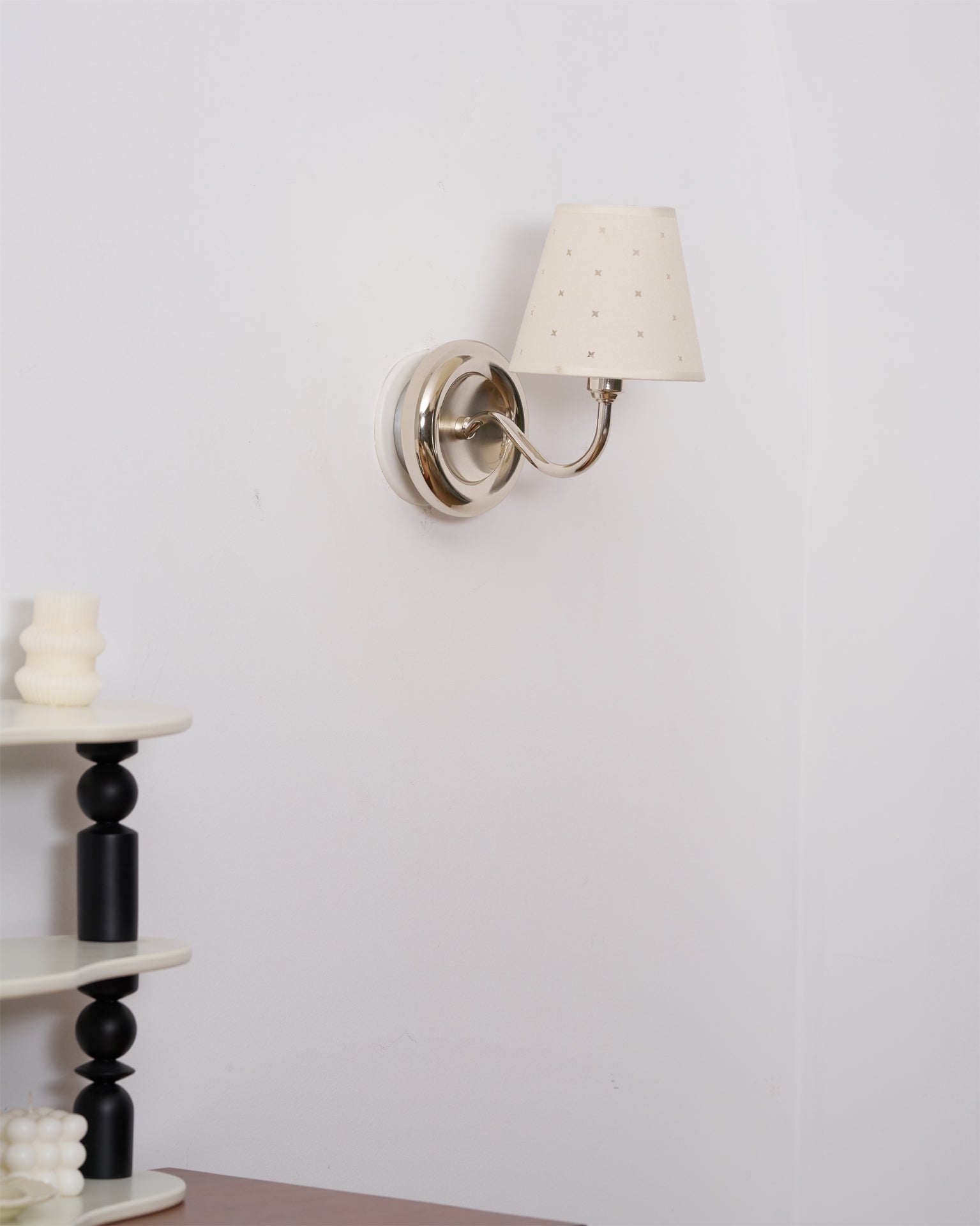 The Caleb sconce turned off, showcasing its sculptural form.