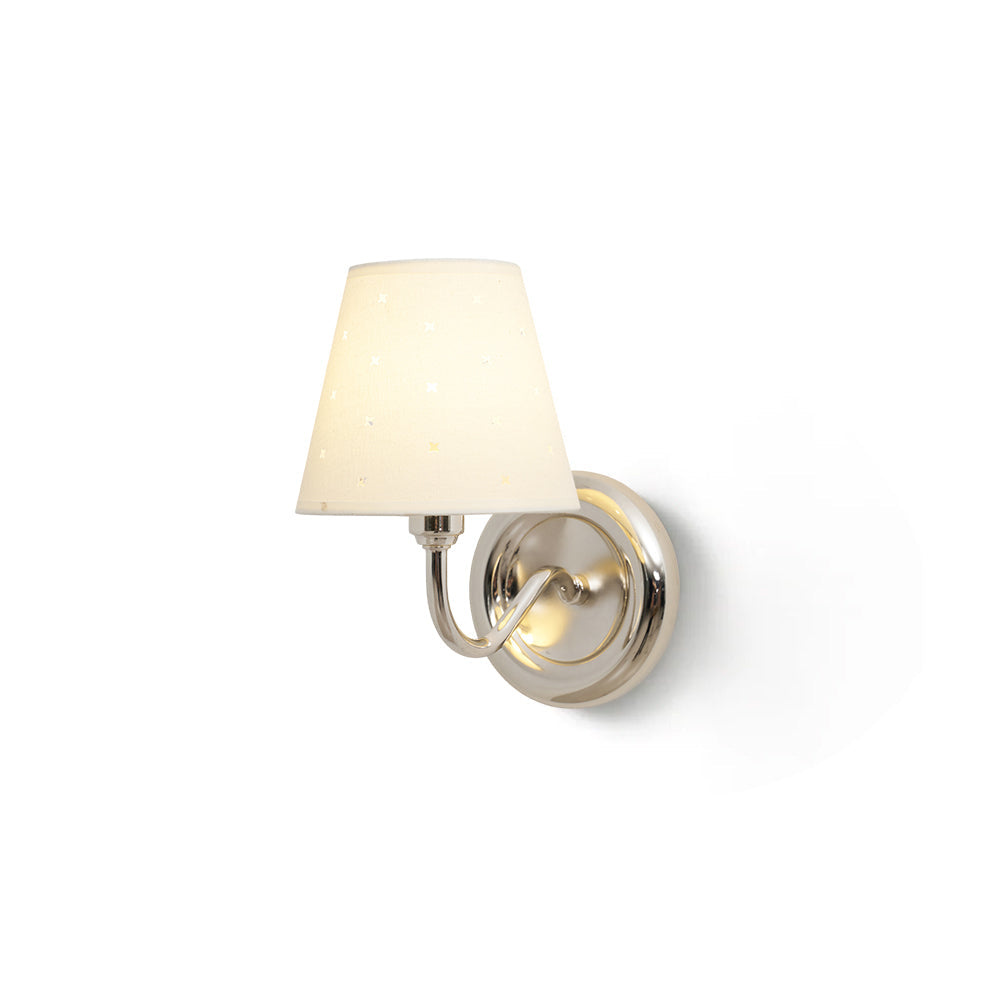 Caleb Starburst Wall Sconce in gold finish against a neutral wall.