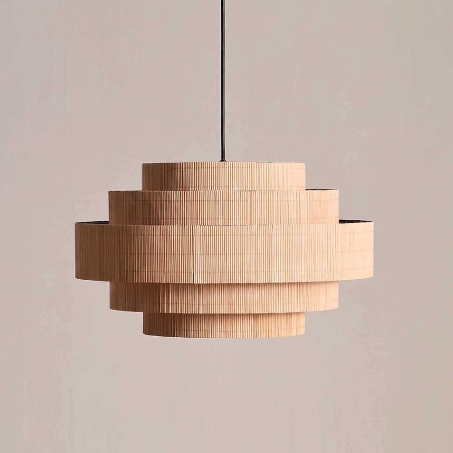 Lifestyle image of the Calista bamboo pendant light illuminating an entryway.