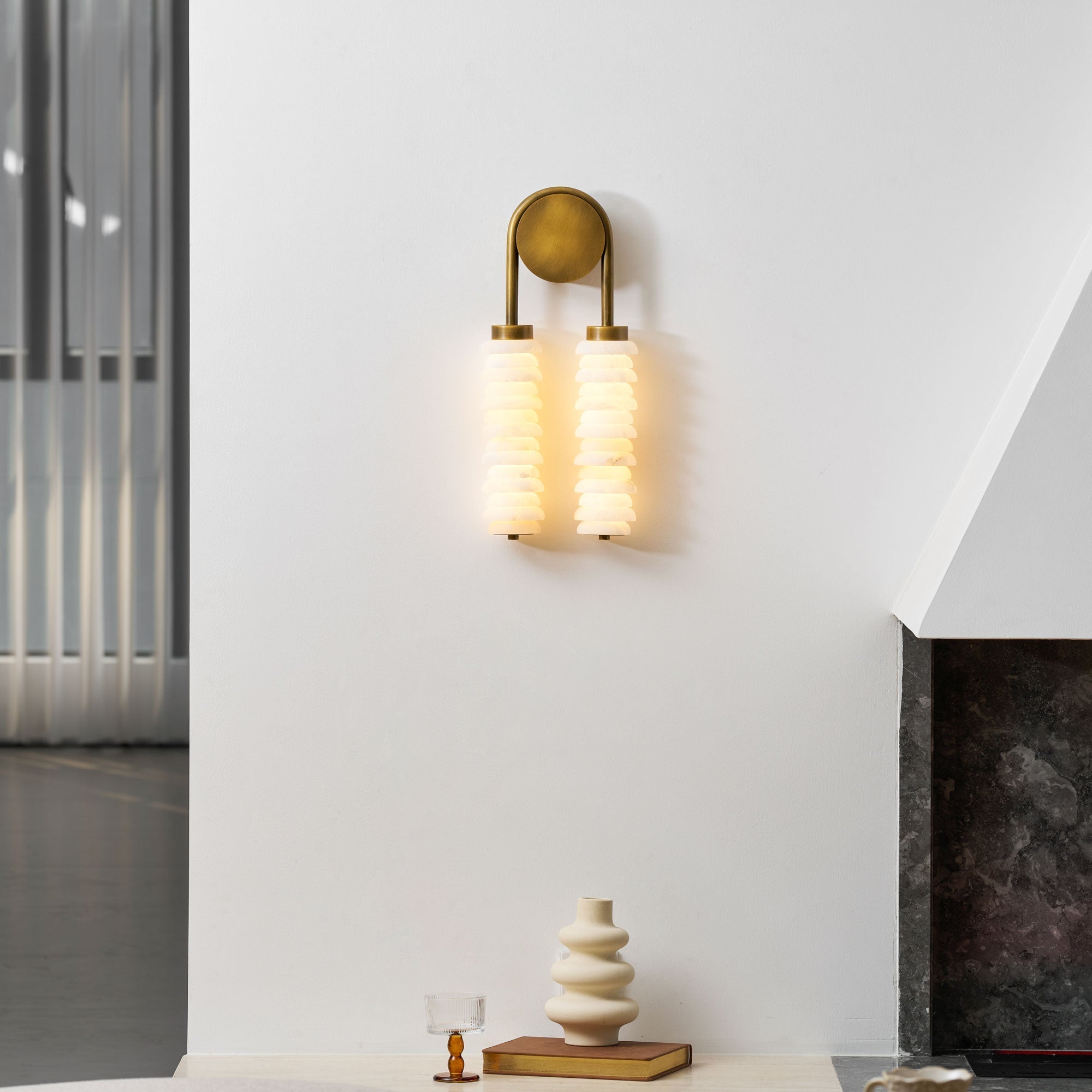 The Payson wall lamp shown unlit, emphasizing its sculptural form.