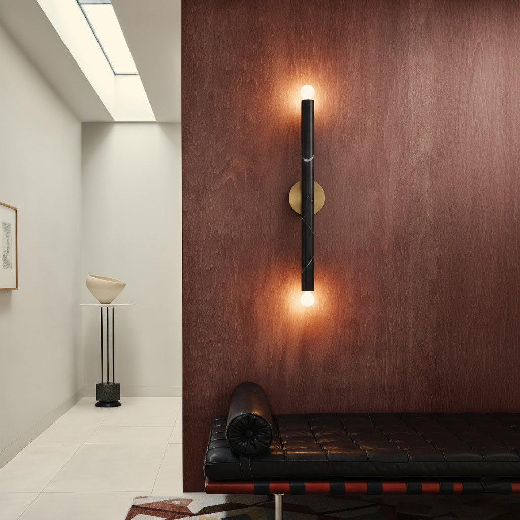 The wall lamp mounted horizontally over a side table.