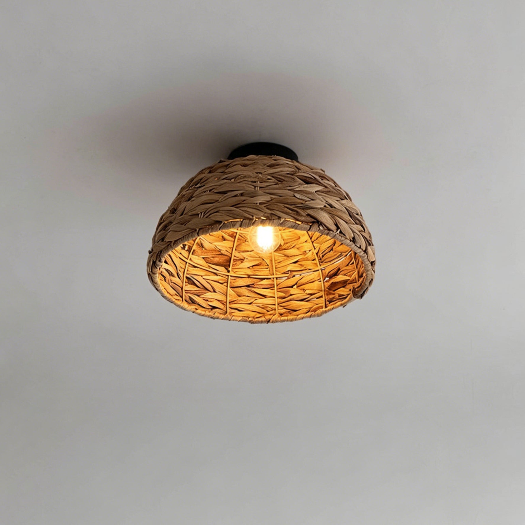Lifestyle image showing the Cambria Ceiling Light in a bright, airy bedroom setting.