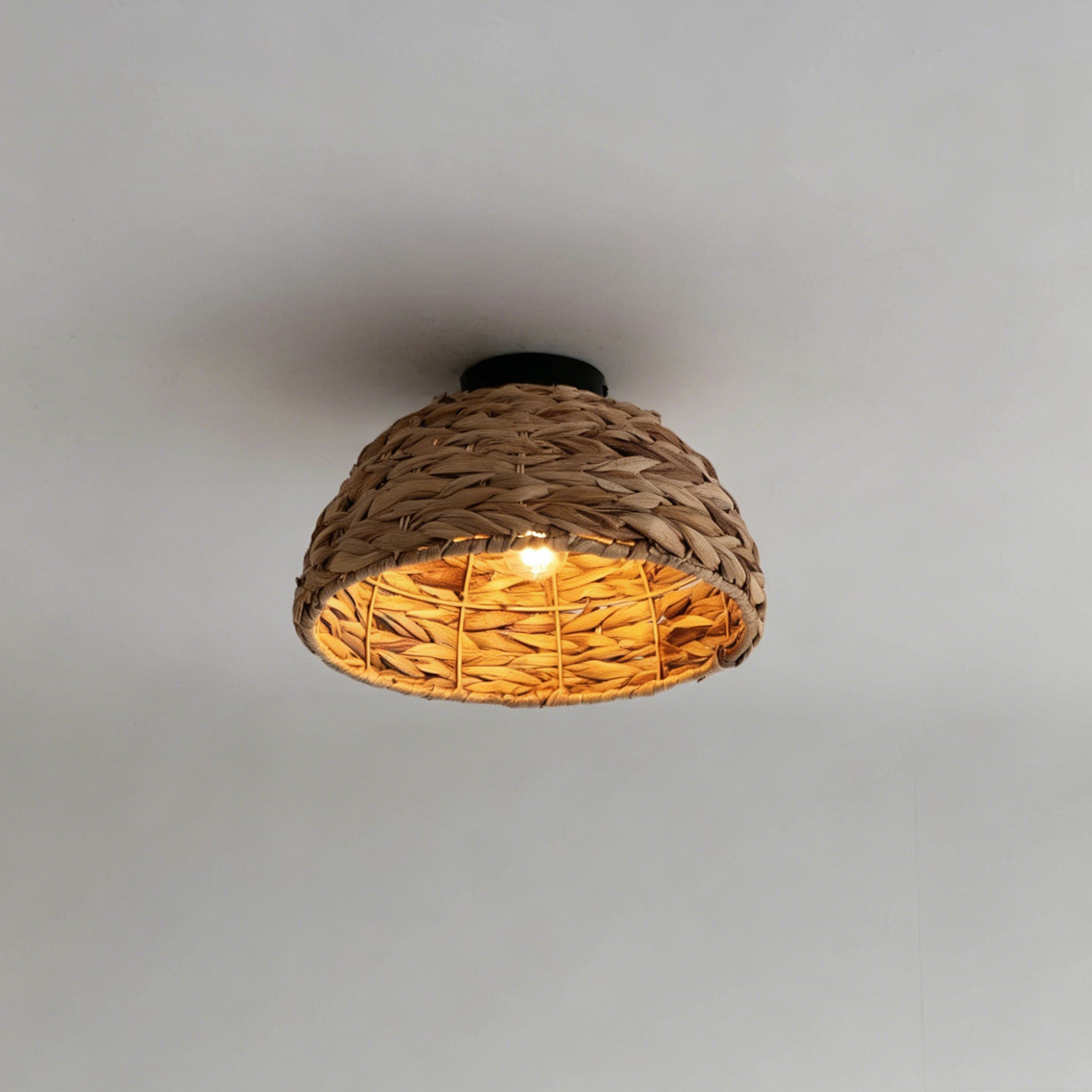 Close-up view of the intricate brown weave of the Cambria Ceiling Light.