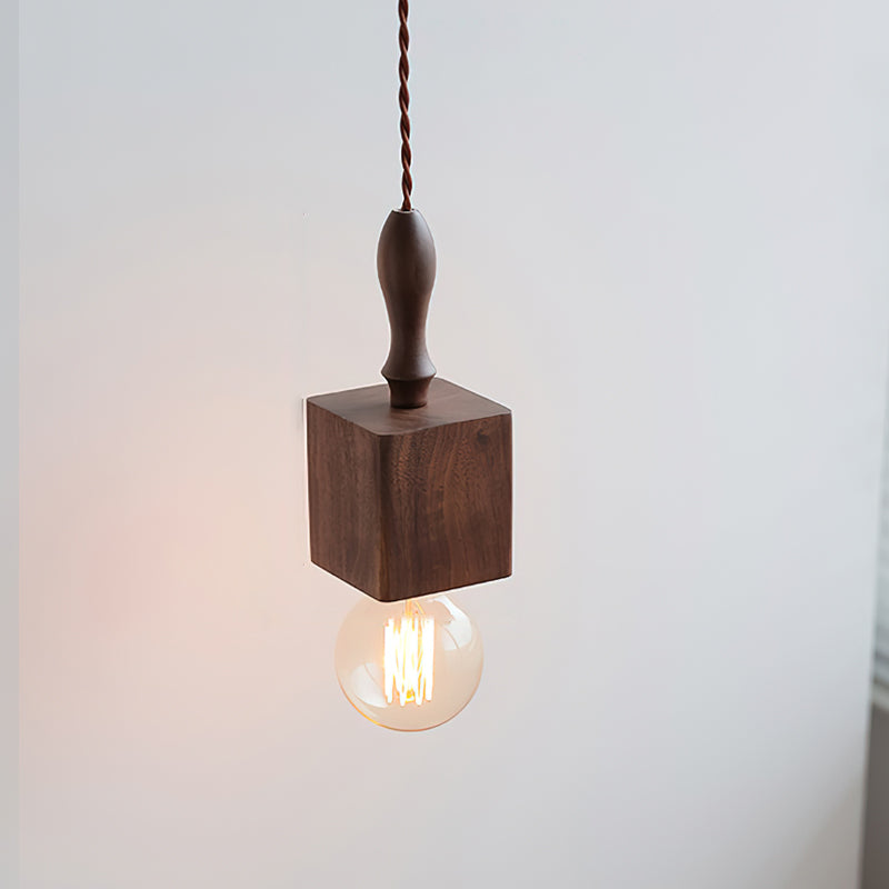 Lifestyle image of the Cano Pendant Light in a rustic-themed dining area.